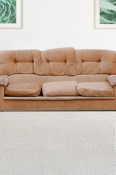 Old brown couch that's ready for furniture removal and disposal