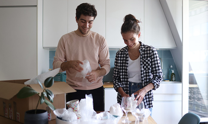 Multiple boxes packed with kitchen items.