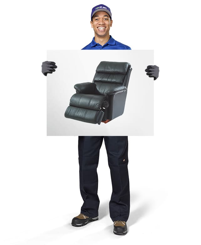 1-800-GOT-JUNK? Truck Team Member holding an image of a recliner