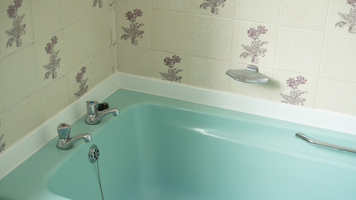 An old bathtub in a house.